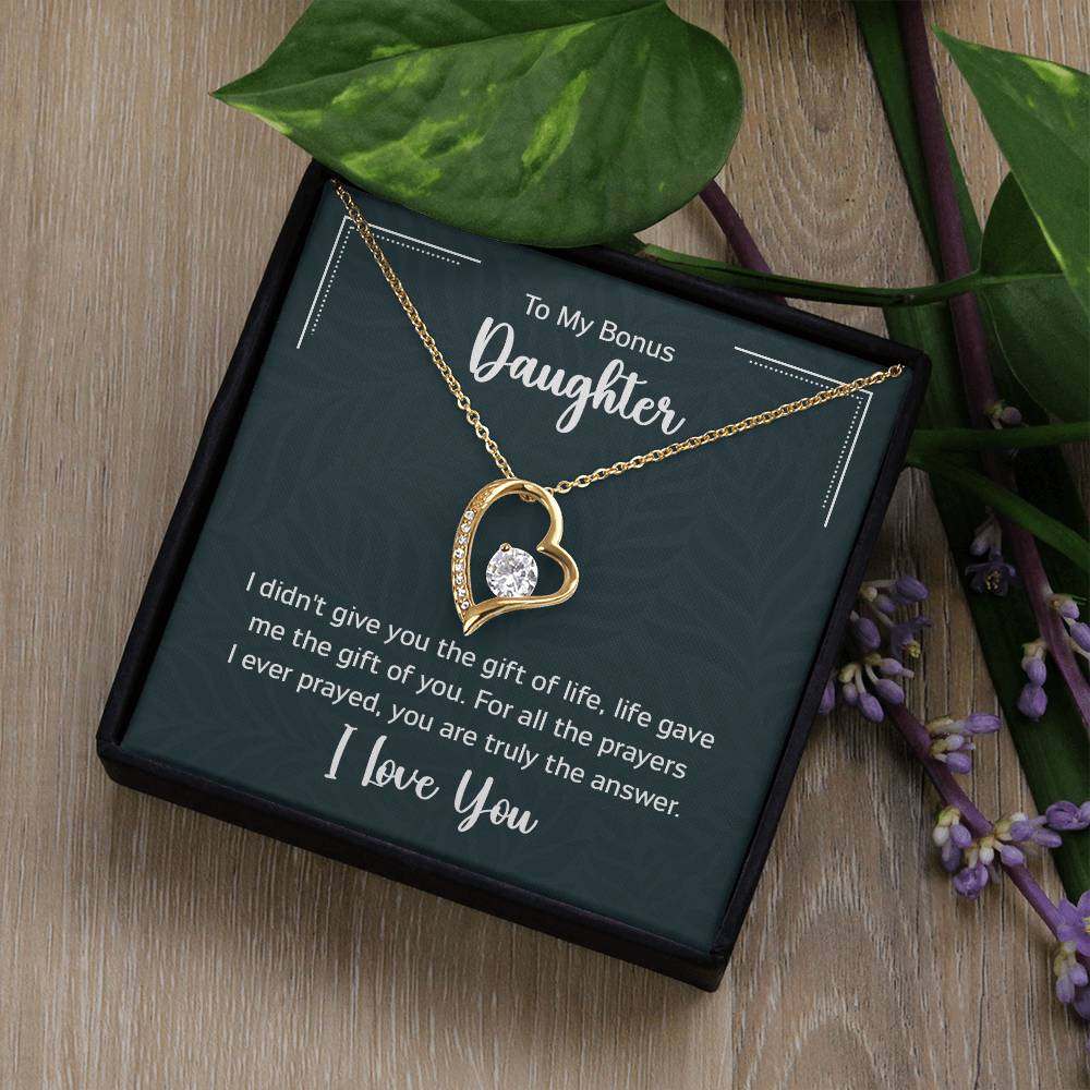 Forever Love Necklace for Bonus Daughter in gift box with heartfelt message, featuring a heart pendant with 6.5mm CZ crystal, available in white or yellow gold finish.