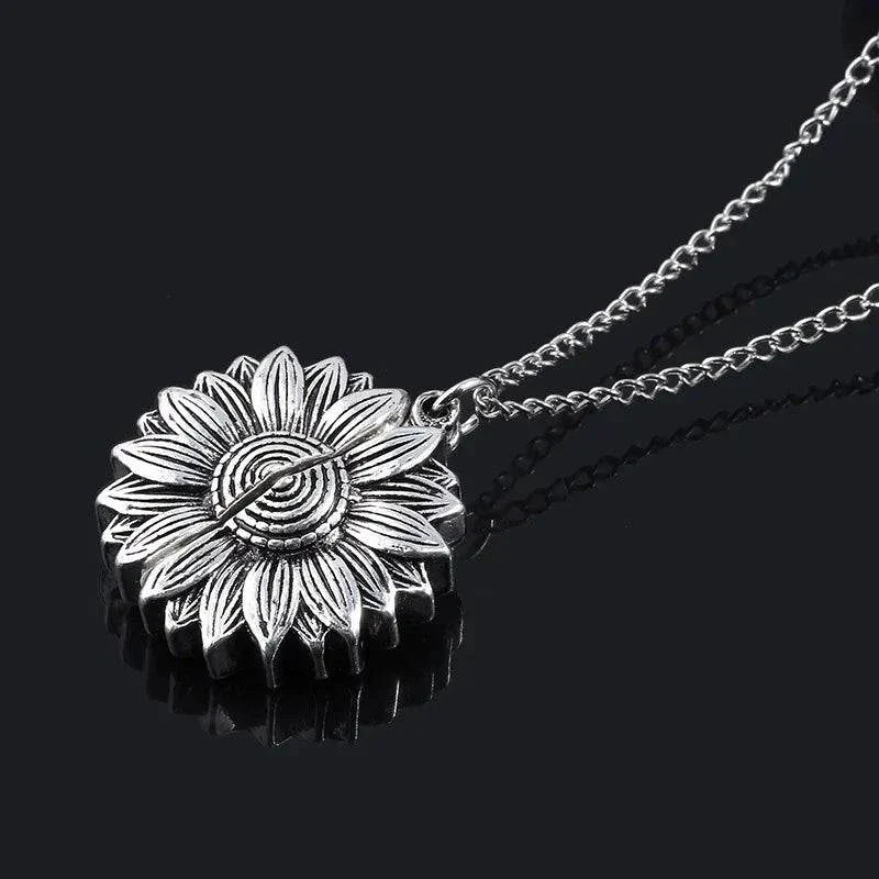 Sunflower necklace with hidden message, elegant and meaningful jewelry piece.