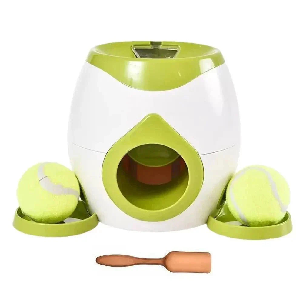 Interactive dog ball thrower with green and white design, tennis balls, and treat dispenser.