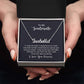 Custom name necklace in gift box with "To My Soulmate" message, displayed by hands.