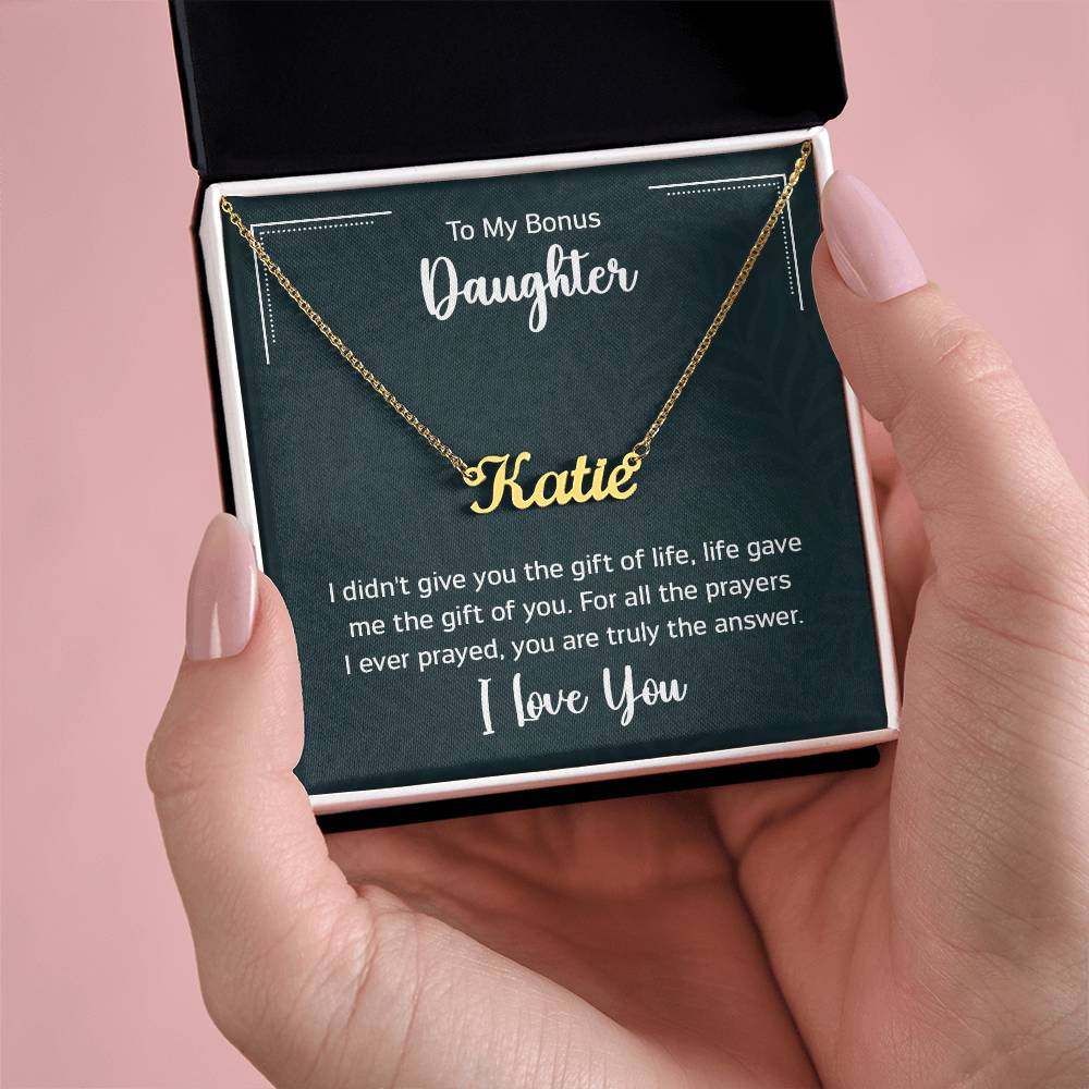 Customised name necklace for daughter in gift box, cursive gold design on adjustable chain.