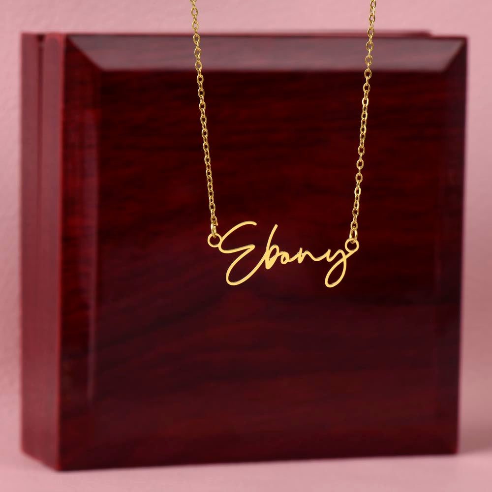 Gold signature name necklace with contemporary font on adjustable chain in gift box.