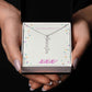 Vertical personalized name necklace, cursive design, adjustable chain, gift packaging.