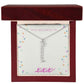 Vertical personalized name necklace in elegant cursive, displayed in a gift box with mahogany finish.