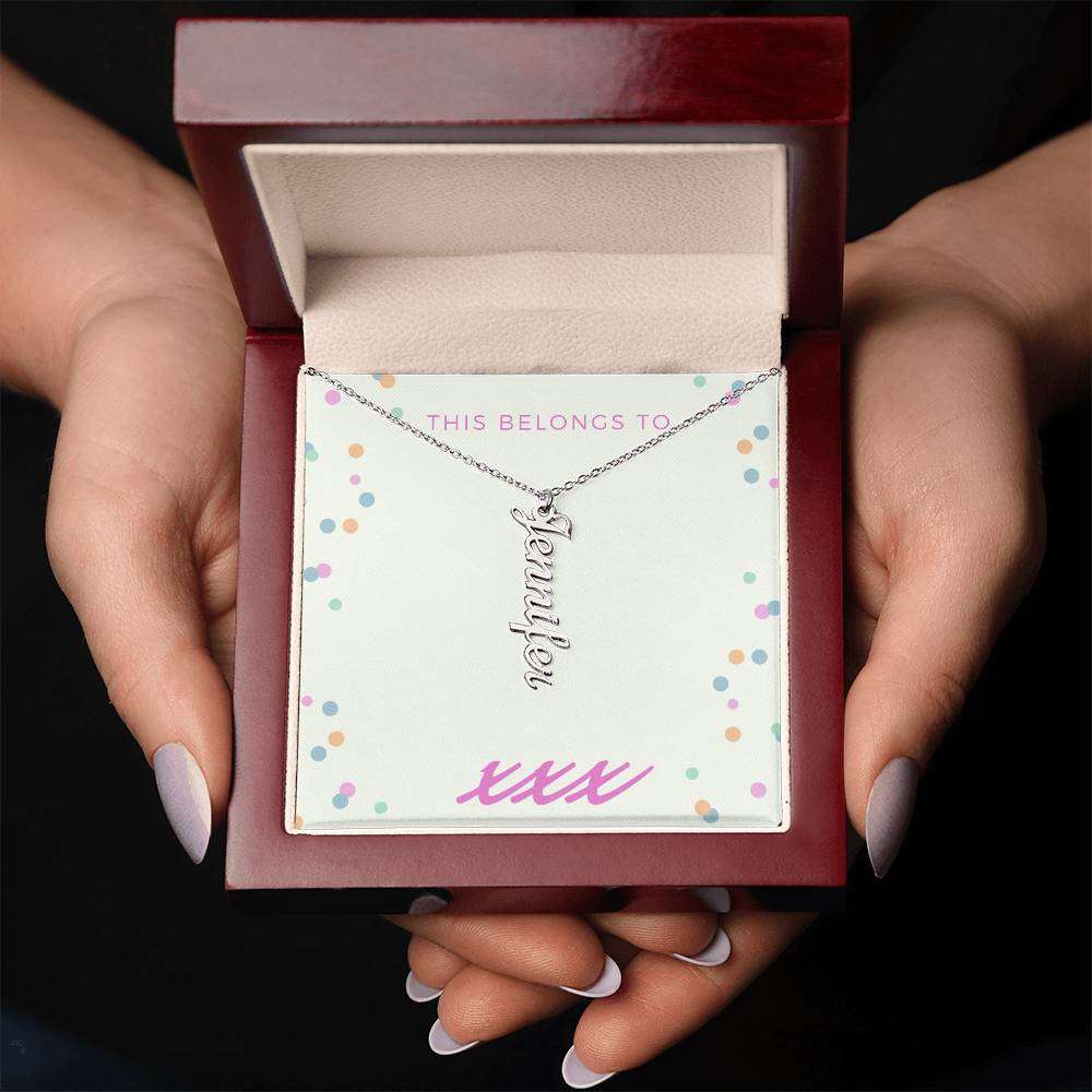 Personalized name necklace in mahogany box, vertical design with cursive text.