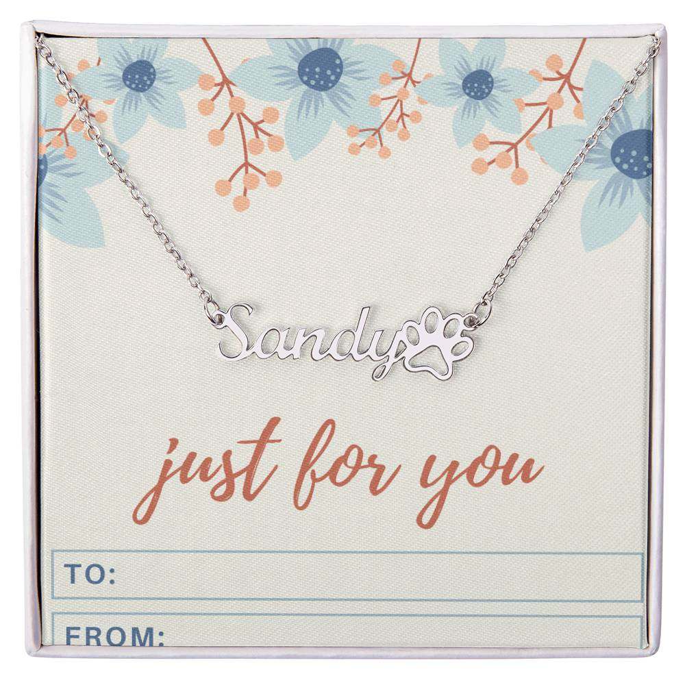 Personalized name necklace with paw print charm on floral gift card.