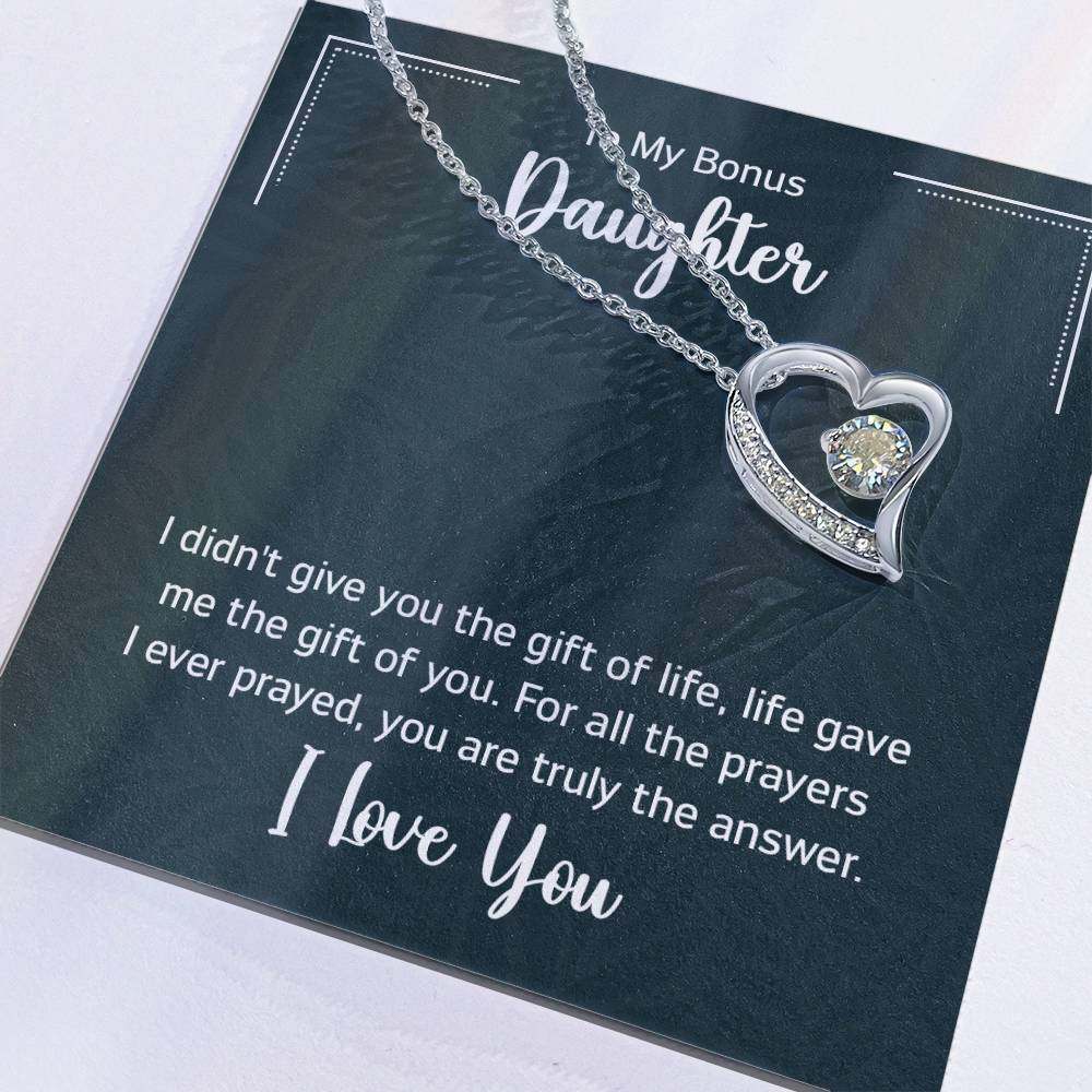 Heart-shaped Forever Love Necklace with CZ crystals on a card for a bonus daughter, featuring a touching message of love.