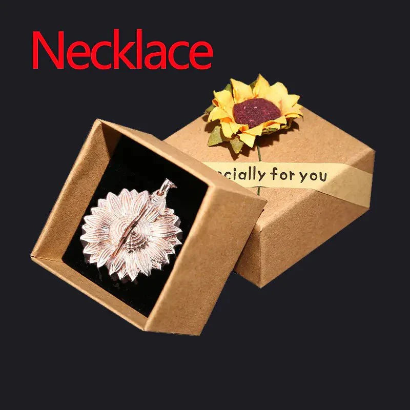 Sunflower necklace with hidden message in gift box, symbolizing happiness and positivity.