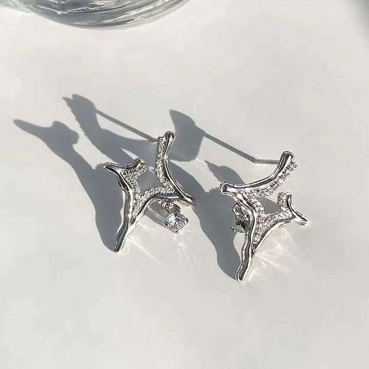 Asterism Rhinestone Earrings with geometric metal design and sparkling stones.