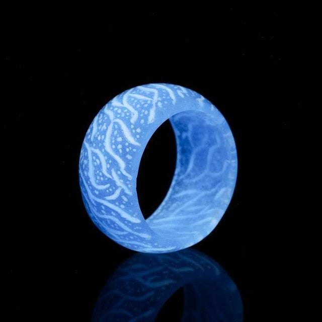 Luminous Blue Love Glow Ring with luminescent glow on black background.